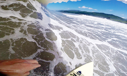 surfer point of view inside a wave